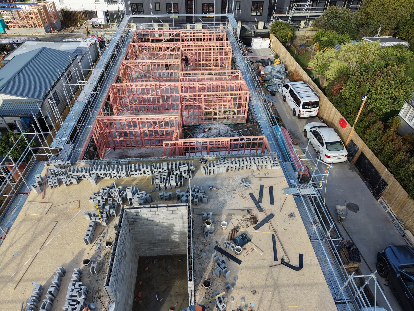 Aerial view of new homes being built across a development site
